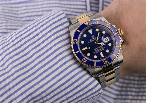 Rolex Submariner on wrist and Size Guide .